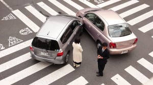 two car accident male and female drivers in intersection